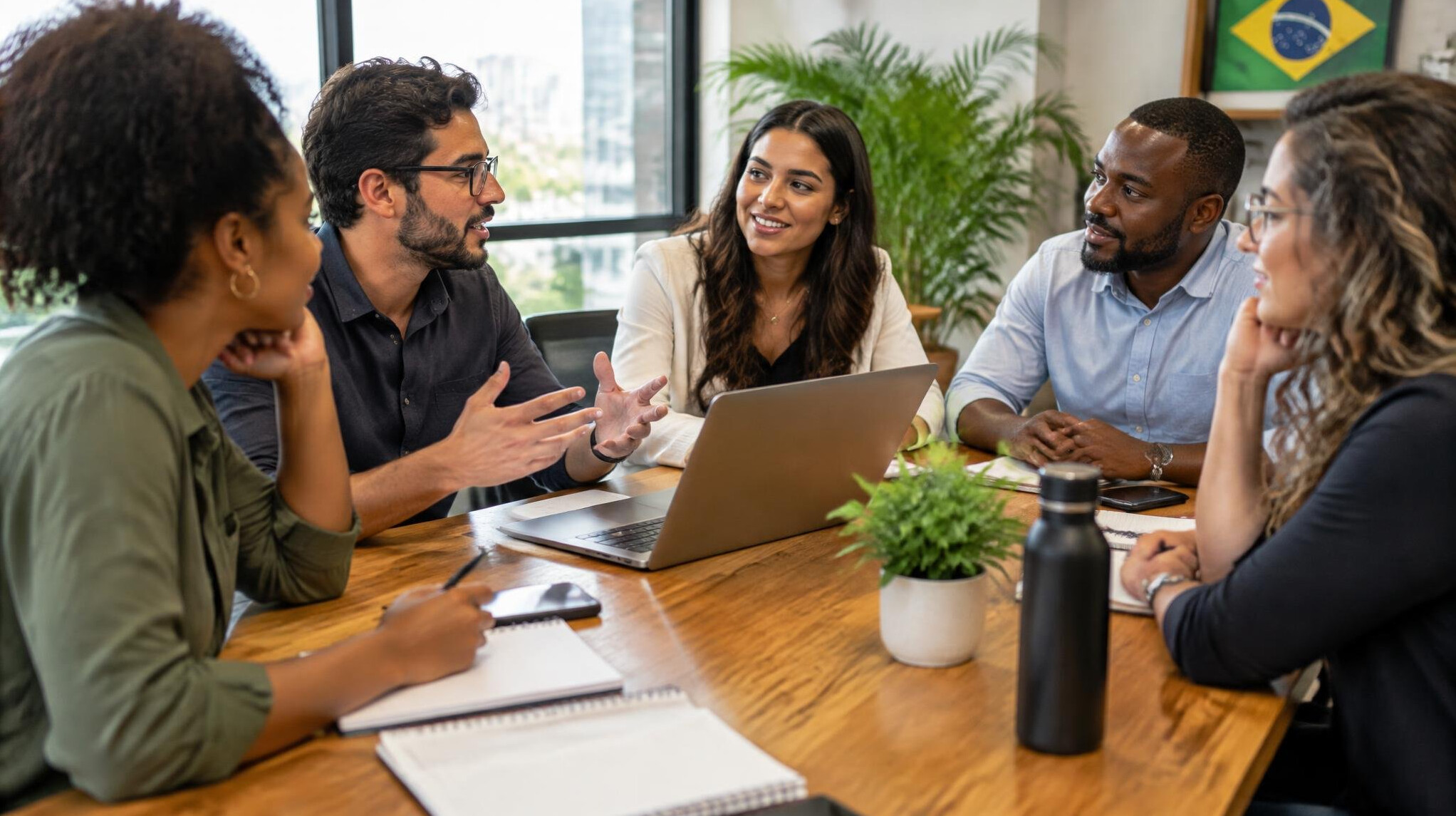 Group of Brazilian professionals having a conversation around a table