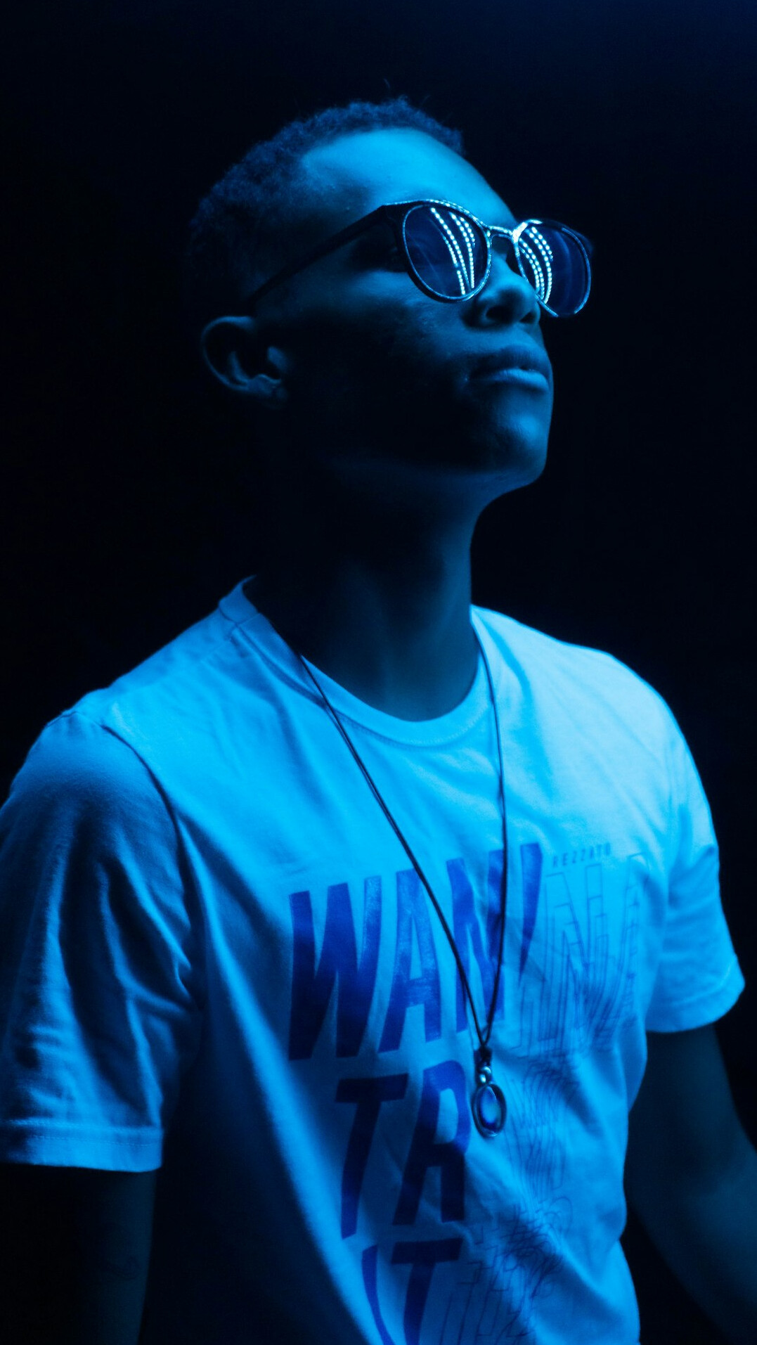 Studio portrait of a Brazilian man with glasses